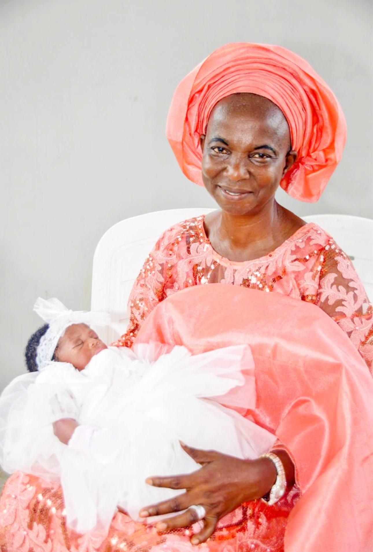 Mummy with one of her granddaughters at her christening ceremony
